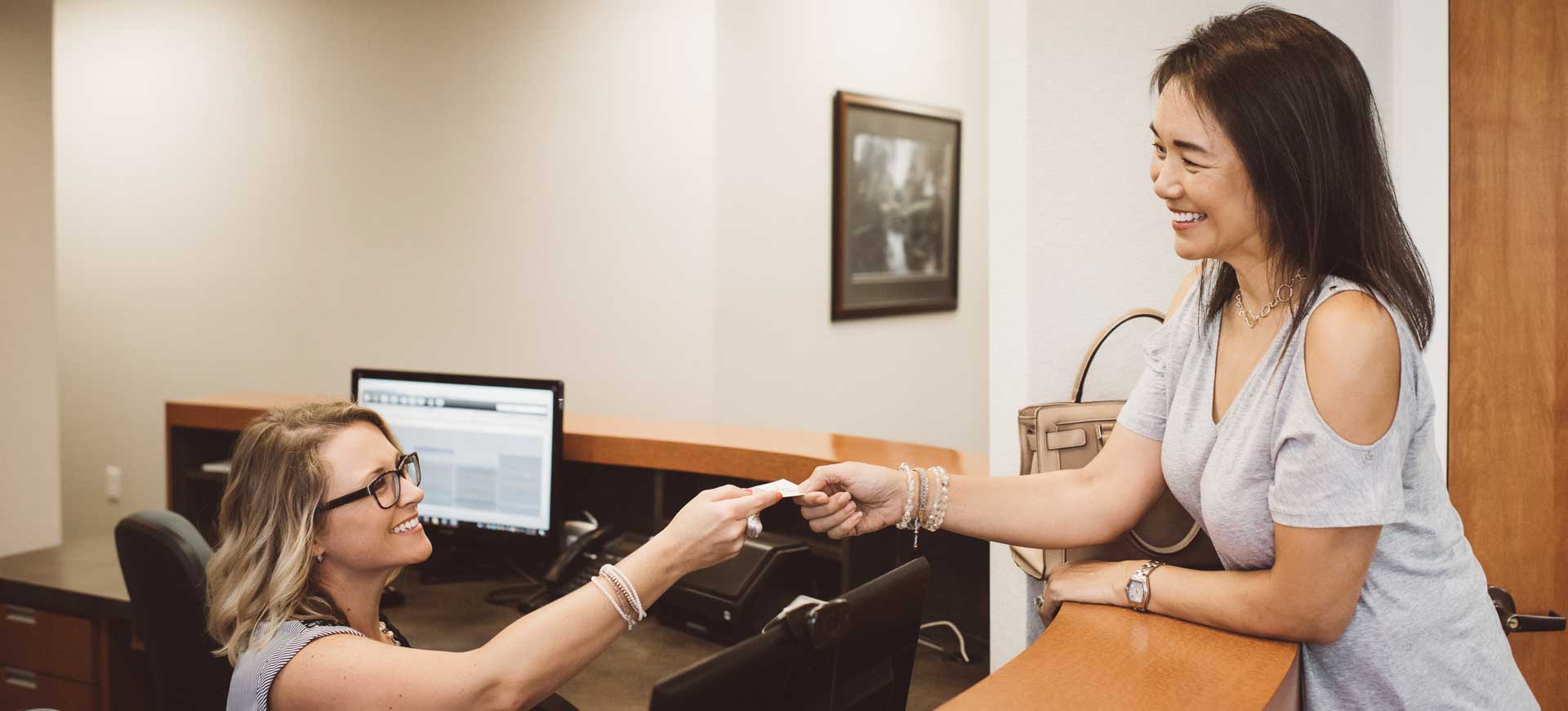 Receptionist greeting patient