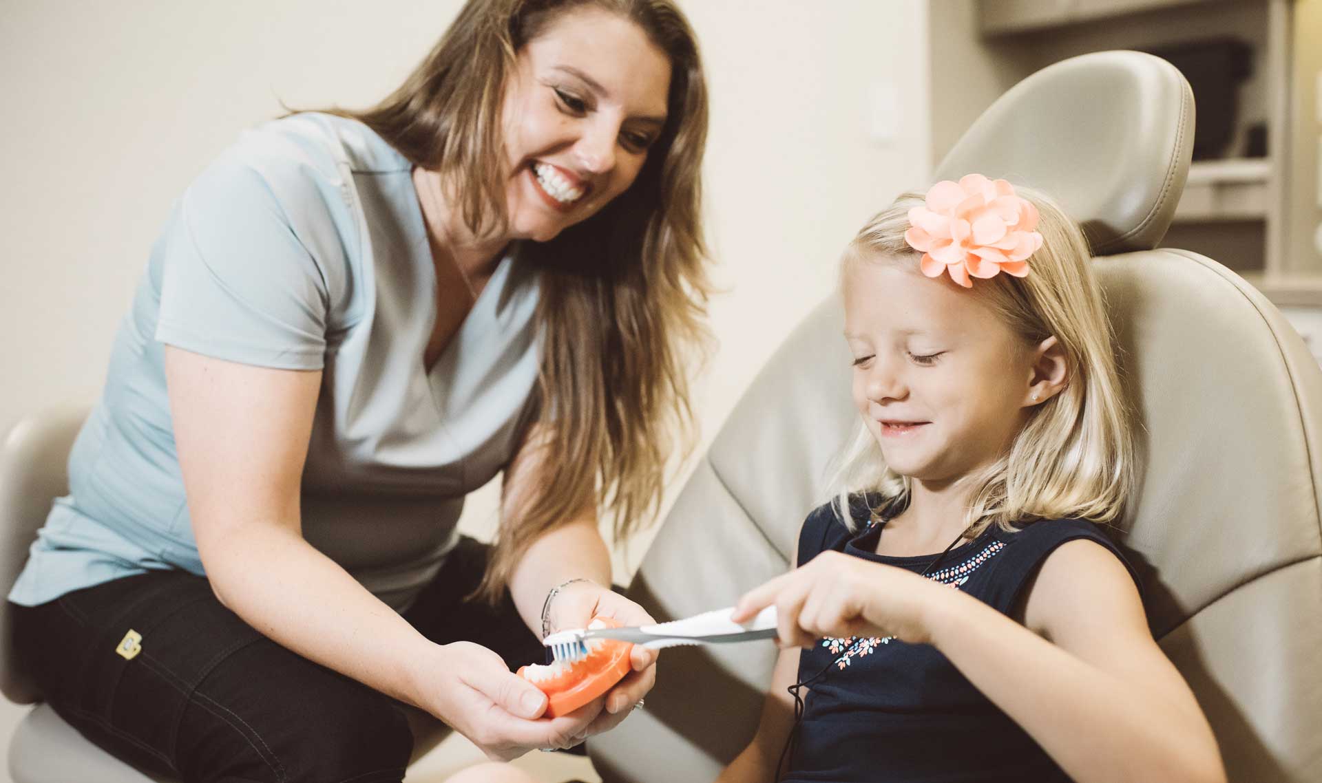 Happy mother and child at the dentist